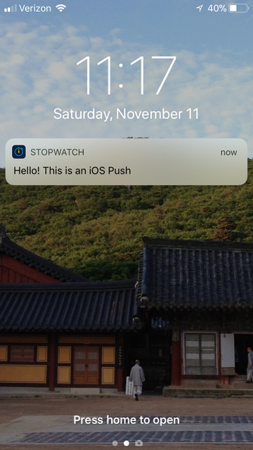 Exemplo de mensagens push do Stopwatch na tela inicial do iPhone que diz: Olá! Este é um push do iOS".